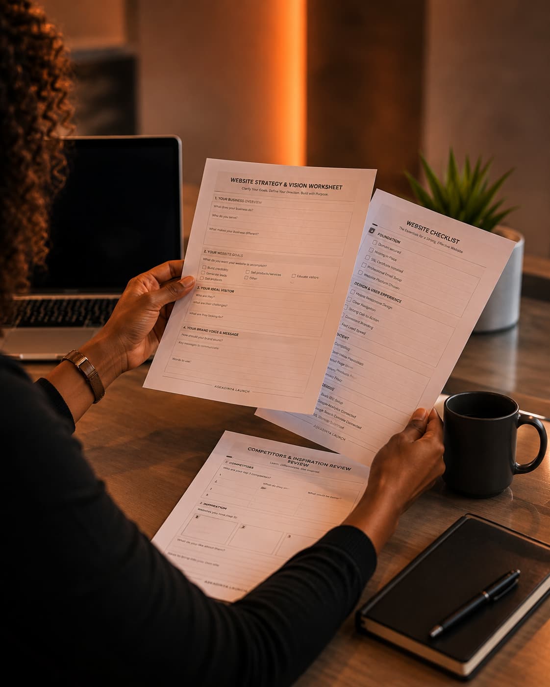 A person reviewing website planning worksheets during a working session